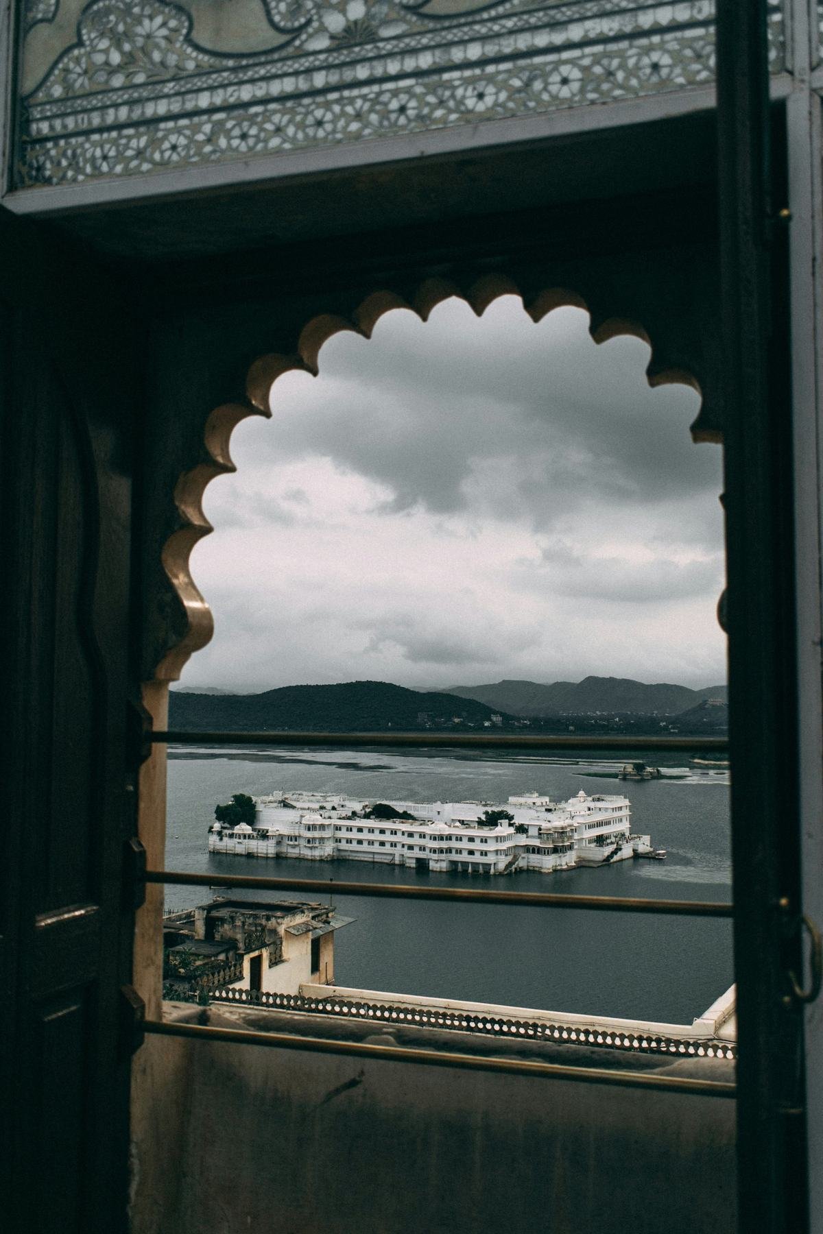 Lake Palace framed by a scalloped arch